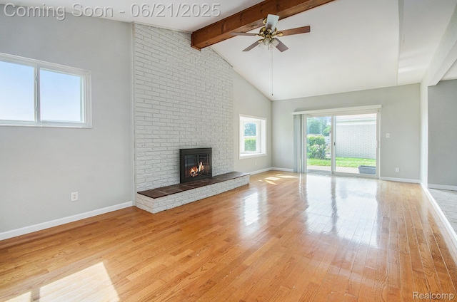 37718 Douglas Ct, Sterling Heights, MI 48310 - unfurnished living room featuring ceiling fan, light wood-type flooring, and a brick fireplace