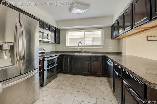 37718 Douglas Ct, Sterling Heights, MI 48310 - kitchen featuring appliances with stainless steel finishes, light stone finish flooring, and dark brown cabinetry