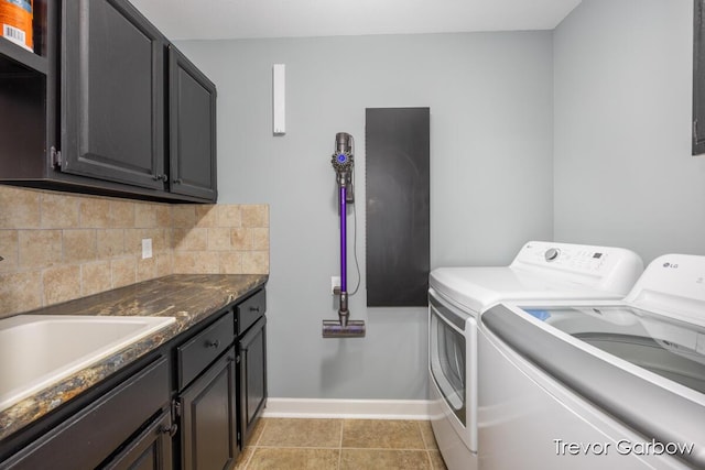 6770 Rivers Edge Ln, Middleville, MI 49333 - washroom featuring washer and clothes dryer and cabinet space