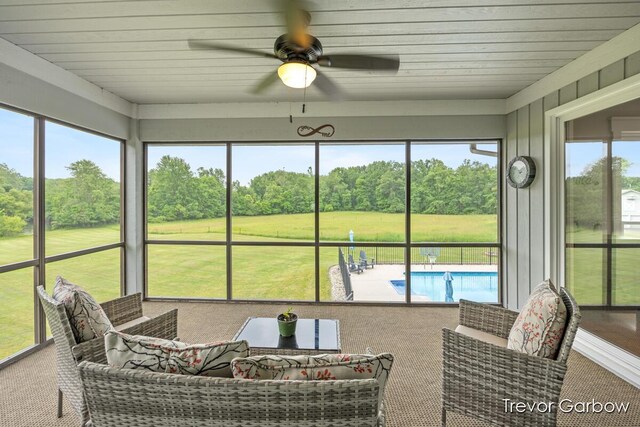 6770 Rivers Edge Ln, Middleville, MI 49333 - sunroom / solarium with ceiling fan, plenty of natural light, and view of wooded area