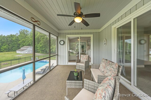 6770 Rivers Edge Ln, Middleville, MI 49333 - sunroom featuring a ceiling fan and an outdoor living space