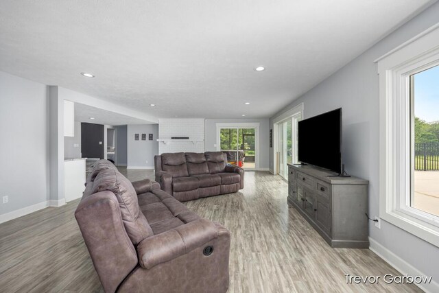 6770 Rivers Edge Ln, Middleville, MI 49333 - living room featuring light wood finished floors, healthy amount of natural light, and recessed lighting