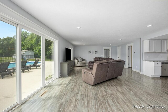 6770 Rivers Edge Ln, Middleville, MI 49333 - living room with light wood-style floors and recessed lighting