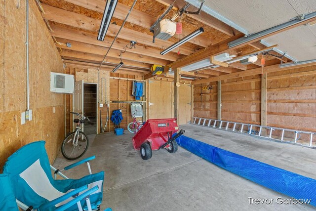 6770 Rivers Edge Ln, Middleville, MI 49333 - garage featuring a garage door opener