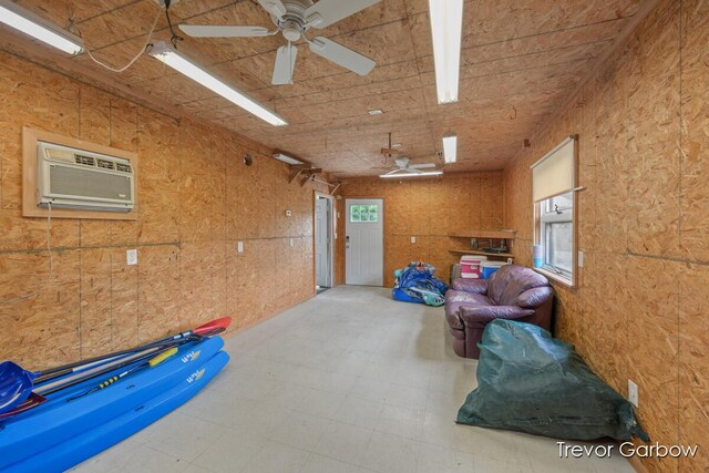 6770 Rivers Edge Ln, Middleville, MI 49333 - storage featuring a wall mounted air conditioner and ceiling fan