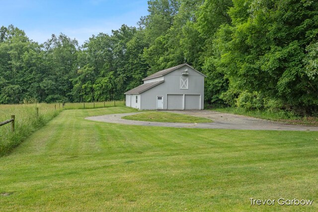 6770 Rivers Edge Ln, Middleville, MI 49333 - view of yard with a detached garage and an outbuilding