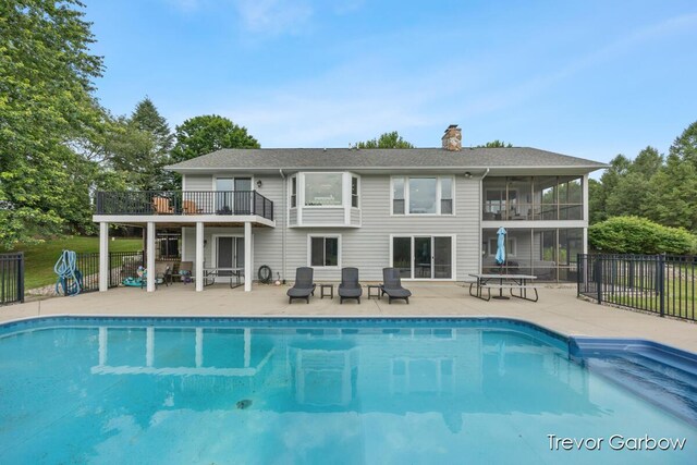 6770 Rivers Edge Ln, Middleville, MI 49333 - view of swimming pool with a patio and a sunroom