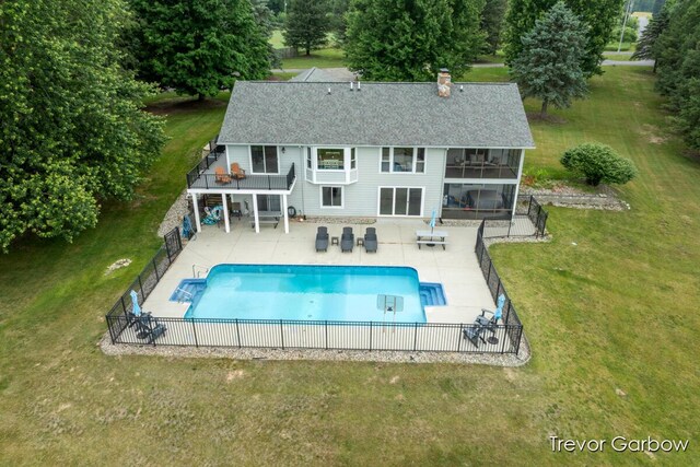6770 Rivers Edge Ln, Middleville, MI 49333 - back of house featuring a fenced backyard, a chimney, a shingled roof, and a patio area