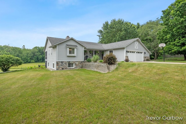 6770 Rivers Edge Ln, Middleville, MI 49333 - view of front facade with driveway, a front lawn, and stone siding