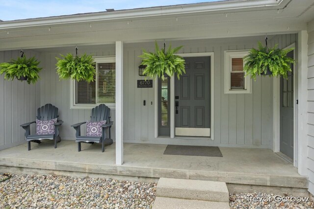 6770 Rivers Edge Ln, Middleville, MI 49333 - view of exterior entry featuring covered porch
