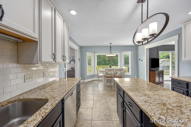 6770 Rivers Edge Ln, Middleville, MI 49333 - kitchen featuring dishwasher, tasteful backsplash, healthy amount of natural light, hanging light fixtures, and recessed lighting
