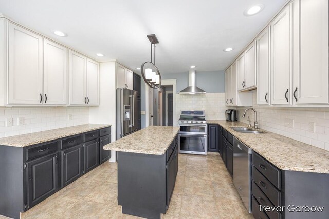 6770 Rivers Edge Ln, Middleville, MI 49333 - kitchen with stainless steel appliances, wall chimney range hood, decorative backsplash, a center island, and recessed lighting