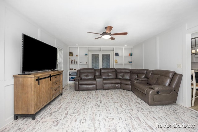 6770 Rivers Edge Ln, Middleville, MI 49333 - living area featuring a ceiling fan and light wood-style floors