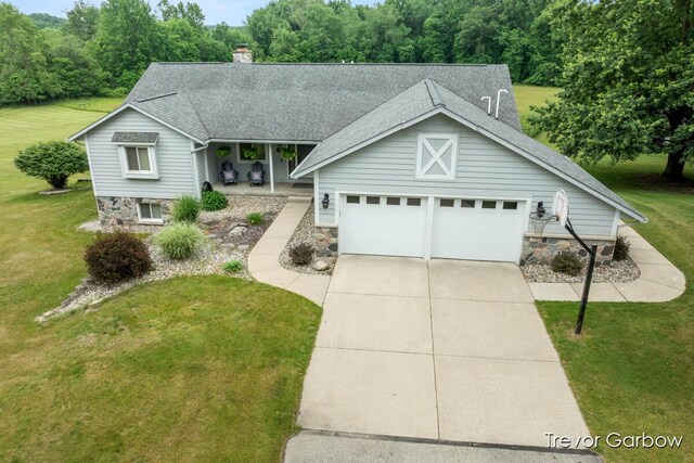 6770 Rivers Edge Ln, Middleville, MI 49333 - view of front of house featuring roof with shingles, a front yard, concrete driveway, and a porch