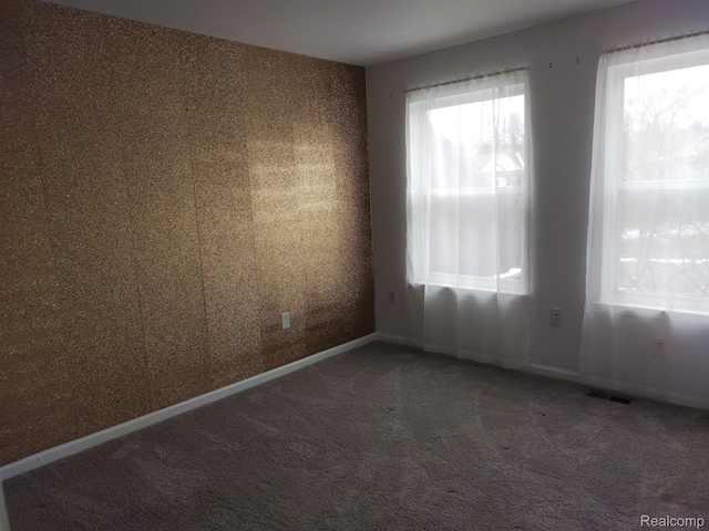 8993 Haymarket St, White Lake, MI 48386 - carpeted spare room featuring baseboards