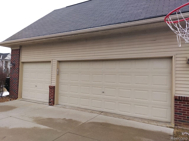 8993 Haymarket St, White Lake, MI 48386 - garage featuring driveway