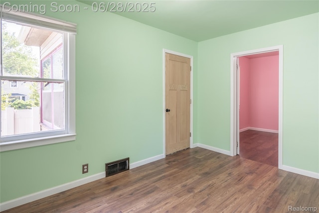 785 Kenilworth Ave, Pontiac, MI 48340 - unfurnished bedroom with dark wood-style flooring and a closet
