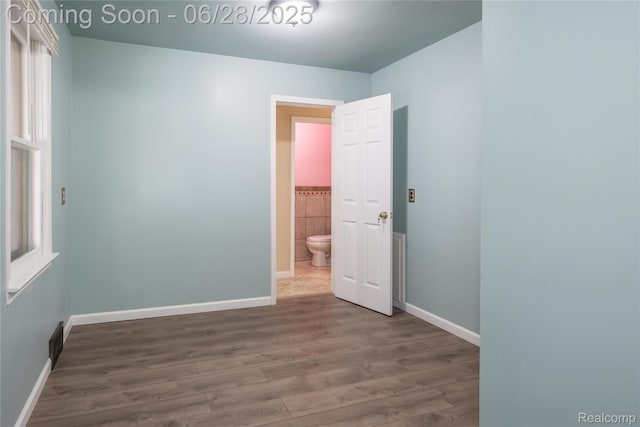 785 Kenilworth Ave, Pontiac, MI 48340 - unfurnished room with wood finished floors and baseboards