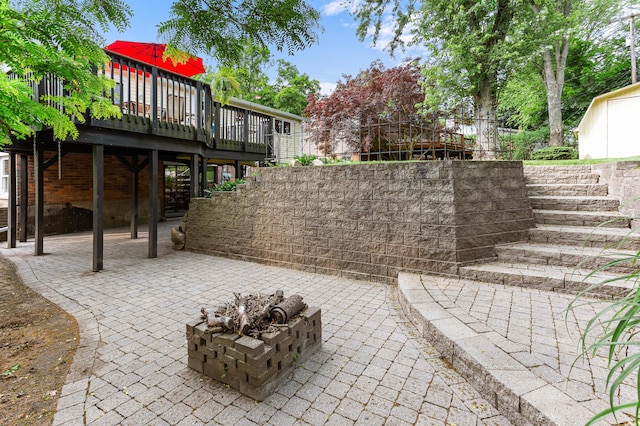 525 Langfield St, Northville, MI 48167 - view of patio with stairs, a wooden deck, and an outdoor fire pit