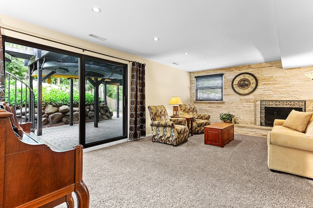 525 Langfield St, Northville, MI 48167 - living area with carpet, plenty of natural light, a stone fireplace, and recessed lighting