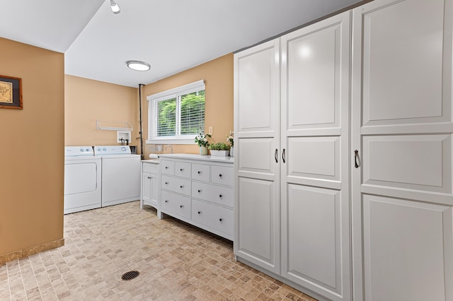 525 Langfield St, Northville, MI 48167 - laundry room featuring washer and clothes dryer and cabinet space
