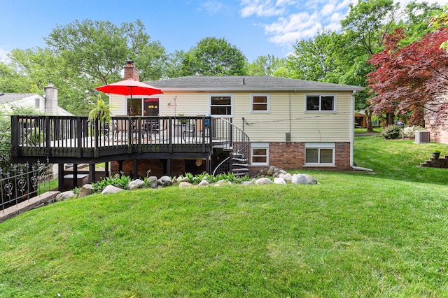 525 Langfield St, Northville, MI 48167 - rear view of house with a wooden deck, a lawn, and a chimney