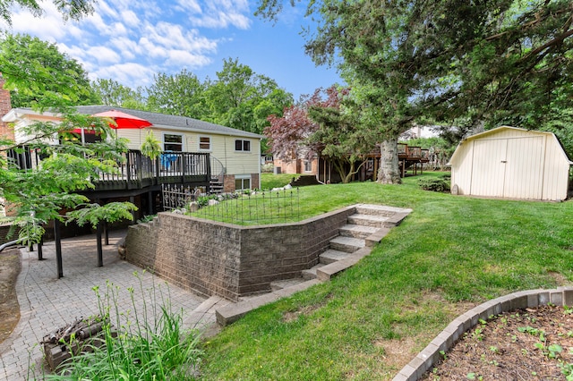525 Langfield St, Northville, MI 48167 - view of grassy yard with a shed, a wooden deck, and a patio
