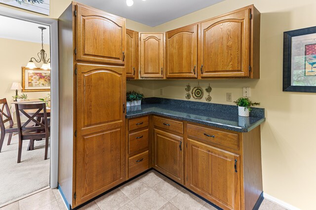 525 Langfield St, Northville, MI 48167 - kitchen featuring brown cabinetry and light tile patterned floors
