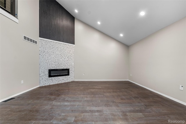 24790 Ashley Ct, Redford, MI 48239 - unfurnished living room featuring high vaulted ceiling, wood finished floors, a large fireplace, and recessed lighting