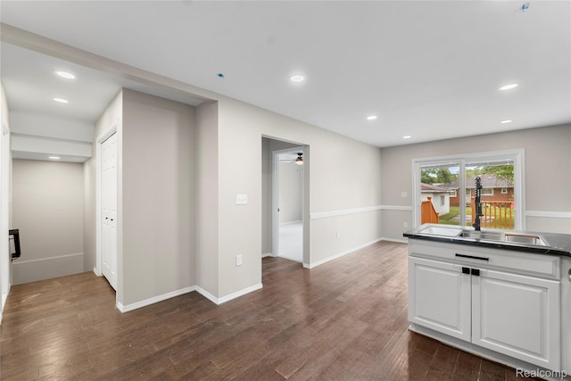 24790 Ashley Ct, Redford, MI 48239 - kitchen with dark countertops, a ceiling fan, dark wood-style flooring, white cabinets, and recessed lighting