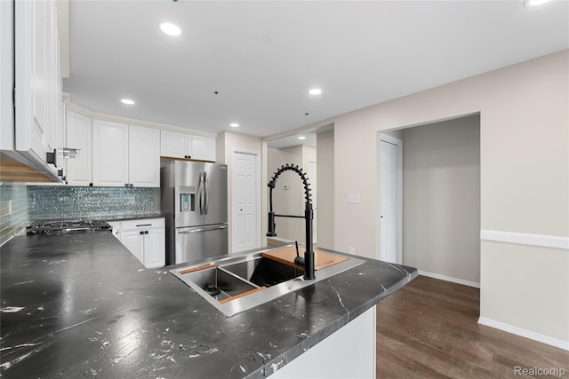 24790 Ashley Ct, Redford, MI 48239 - kitchen with stainless steel fridge, white cabinets, a peninsula, recessed lighting, and dark wood-type flooring