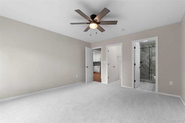 24790 Ashley Ct, Redford, MI 48239 - unfurnished bedroom with light carpet, a spacious closet, ensuite bathroom, a ceiling fan, and a closet
