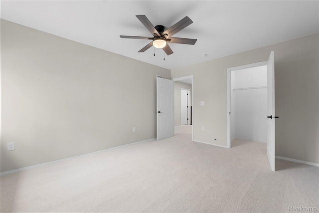 24790 Ashley Ct, Redford, MI 48239 - unfurnished bedroom with light carpet, a walk in closet, ceiling fan, and a closet