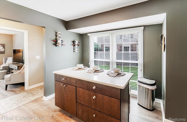 1106 Kings Cove Dr Unit 355, Rochester, MI 48306 - kitchen with light wood-type flooring and light countertops