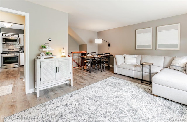 1106 Kings Cove Dr Unit 355, Rochester, MI 48306 - living area featuring wood finished floors and baseboards