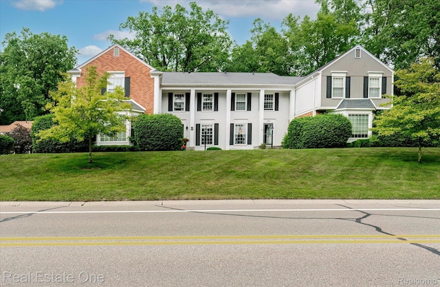 1106 Kings Cove Dr Unit 355, Rochester, MI 48306 - view of front facade with a front lawn