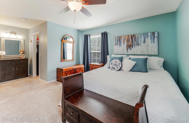 1106 Kings Cove Dr Unit 355, Rochester, MI 48306 - bedroom featuring light colored carpet, ensuite bathroom, and ceiling fan