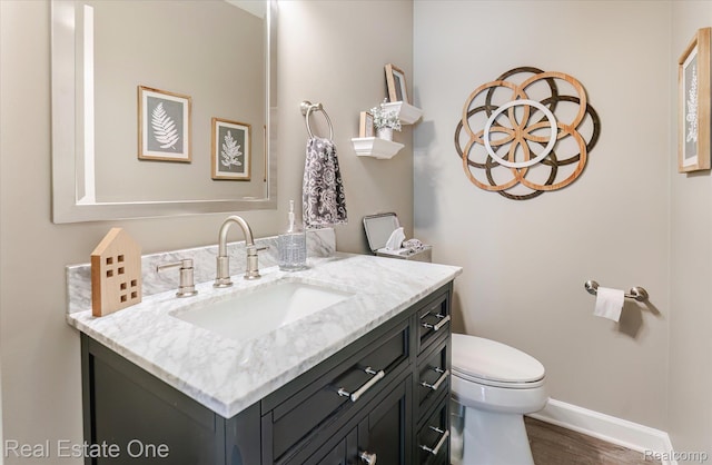 1106 Kings Cove Dr Unit 355, Rochester, MI 48306 - half bath featuring vanity and wood finished floors