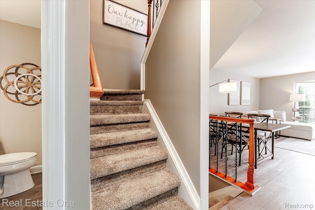 1106 Kings Cove Dr Unit 355, Rochester, MI 48306 - stairs with wood finished floors and baseboards