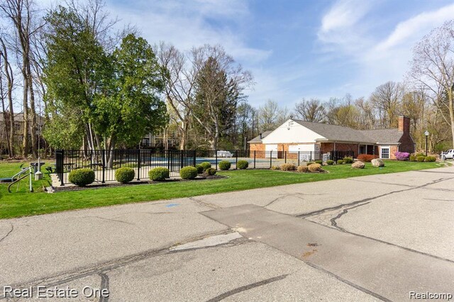 1106 Kings Cove Dr Unit 355, Rochester, MI 48306 - view of front of home with a chimney