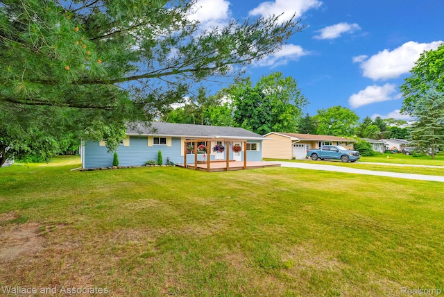 6761 Mels Dr, Ruby, MI 48049 - single story home with concrete driveway and a front lawn