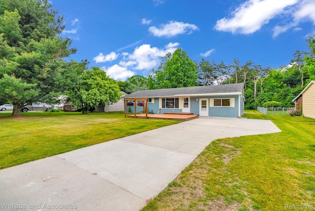 6761 Mels Dr, Ruby, MI 48049 - ranch-style house with concrete driveway and a front lawn