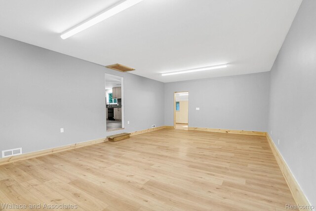 6761 Mels Dr, Ruby, MI 48049 - empty room with light wood-style flooring and baseboards