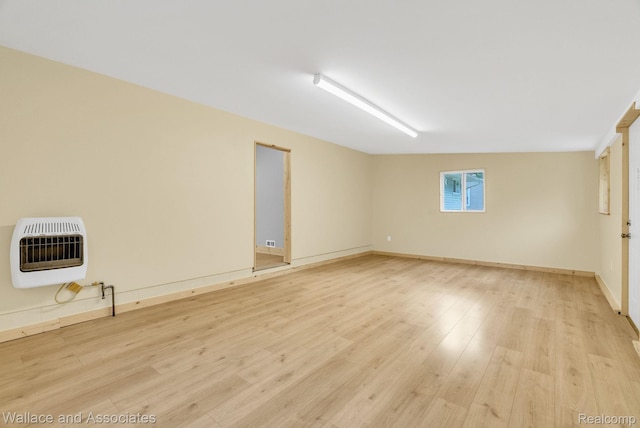 6761 Mels Dr, Ruby, MI 48049 - unfurnished room featuring heating unit and light wood-style floors