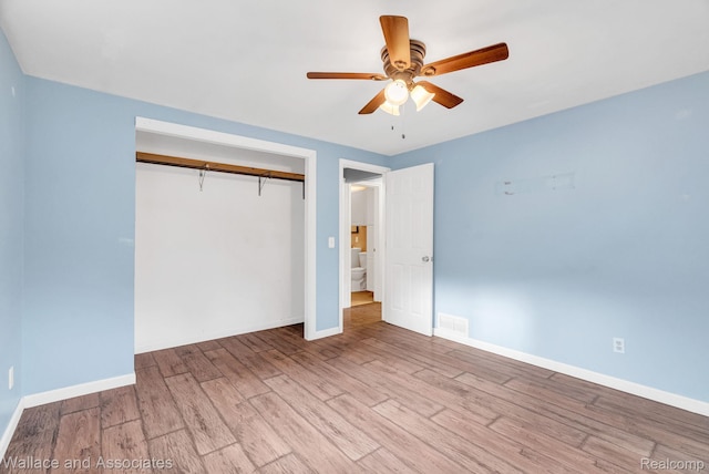 6761 Mels Dr, Ruby, MI 48049 - unfurnished bedroom featuring wood finished floors, a closet, and a ceiling fan