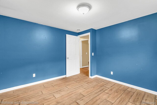 6761 Mels Dr, Ruby, MI 48049 - spare room featuring wood finished floors and baseboards