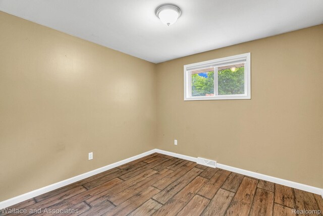 6761 Mels Dr, Ruby, MI 48049 - empty room featuring baseboards and wood finished floors
