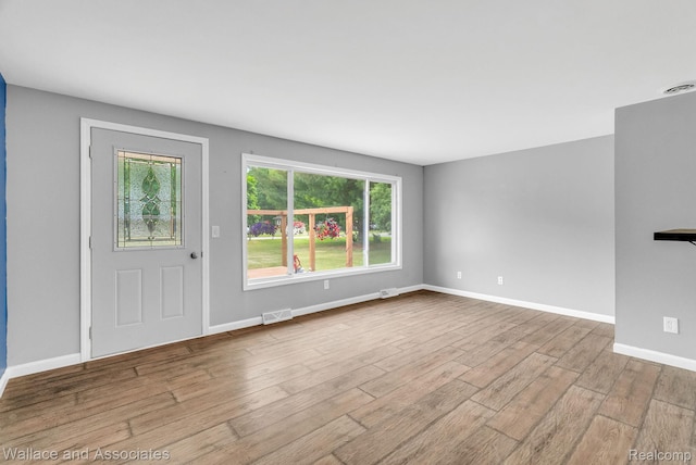 6761 Mels Dr, Ruby, MI 48049 - entrance foyer with wood finished floors and baseboards