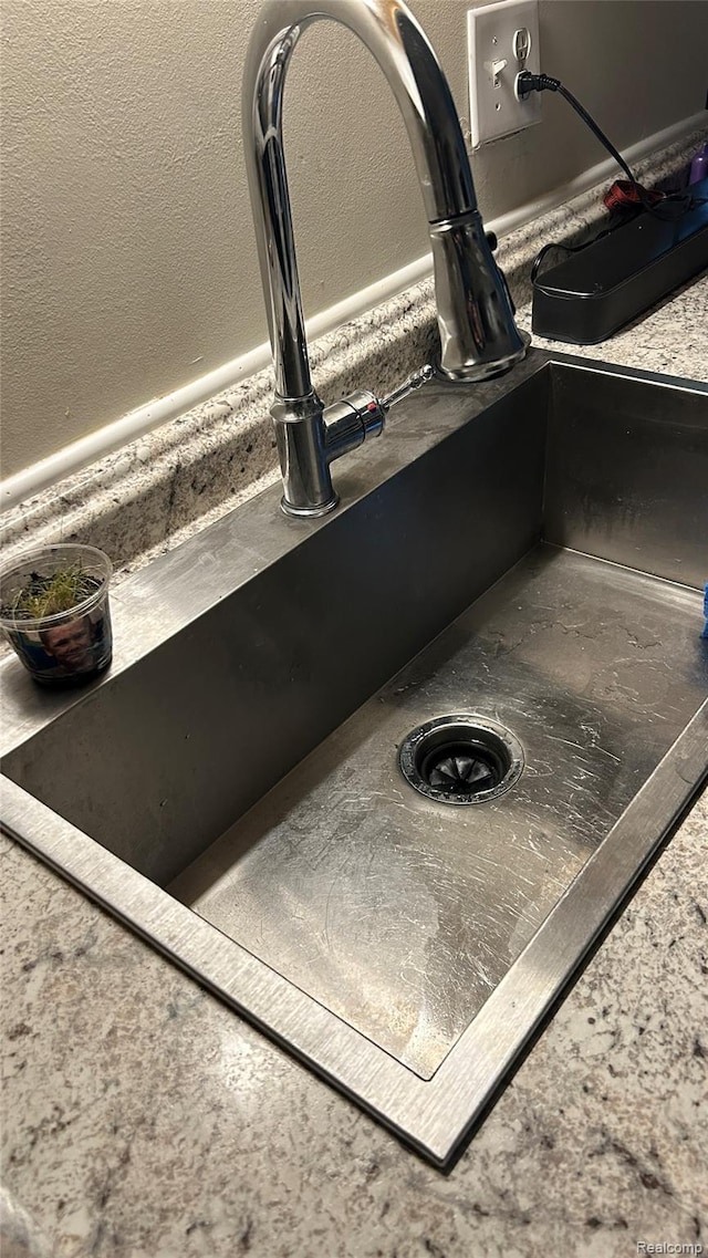 36014 Chapel Ct, Clinton Township, MI 48035 - detailed view of a sink and a textured wall