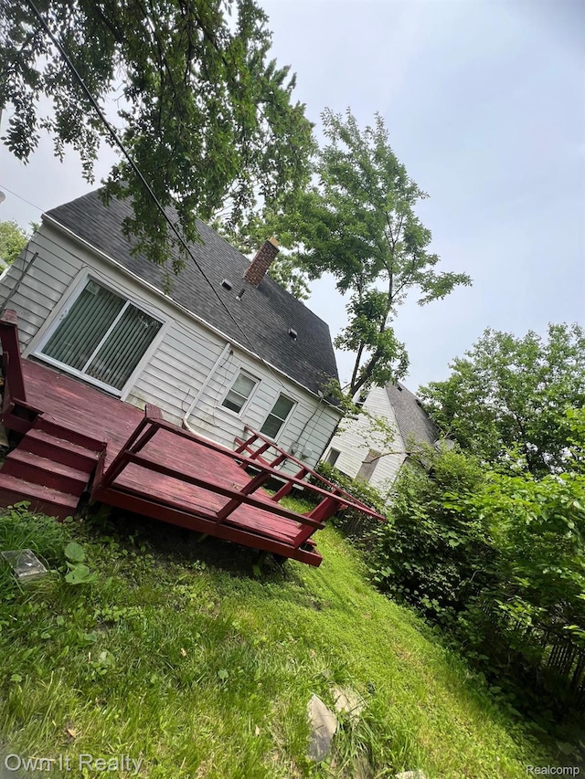 8620 Fielding St, Detroit, MI 48228 - rear view of property with a wooden deck and a shingled roof